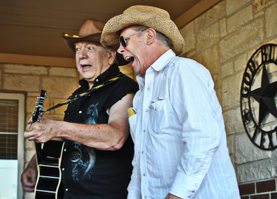 Two cowboys singing